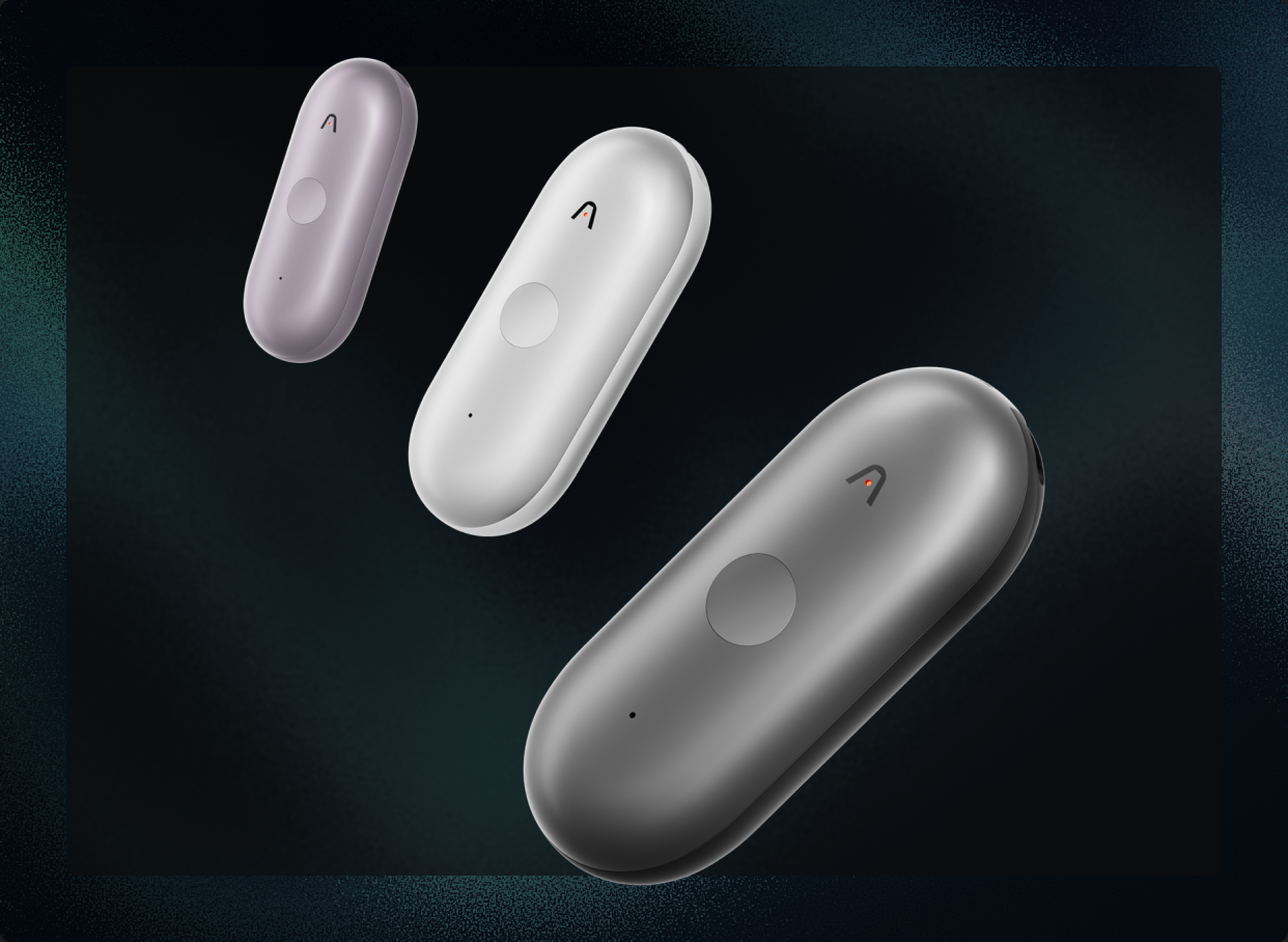 Three Plaud NotePin S devices in lavender, white, and graphite