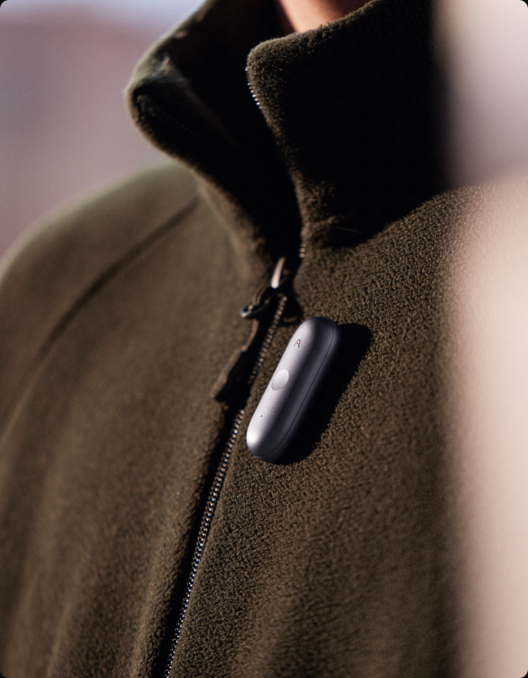 NotePin S clipped to a jacket collar